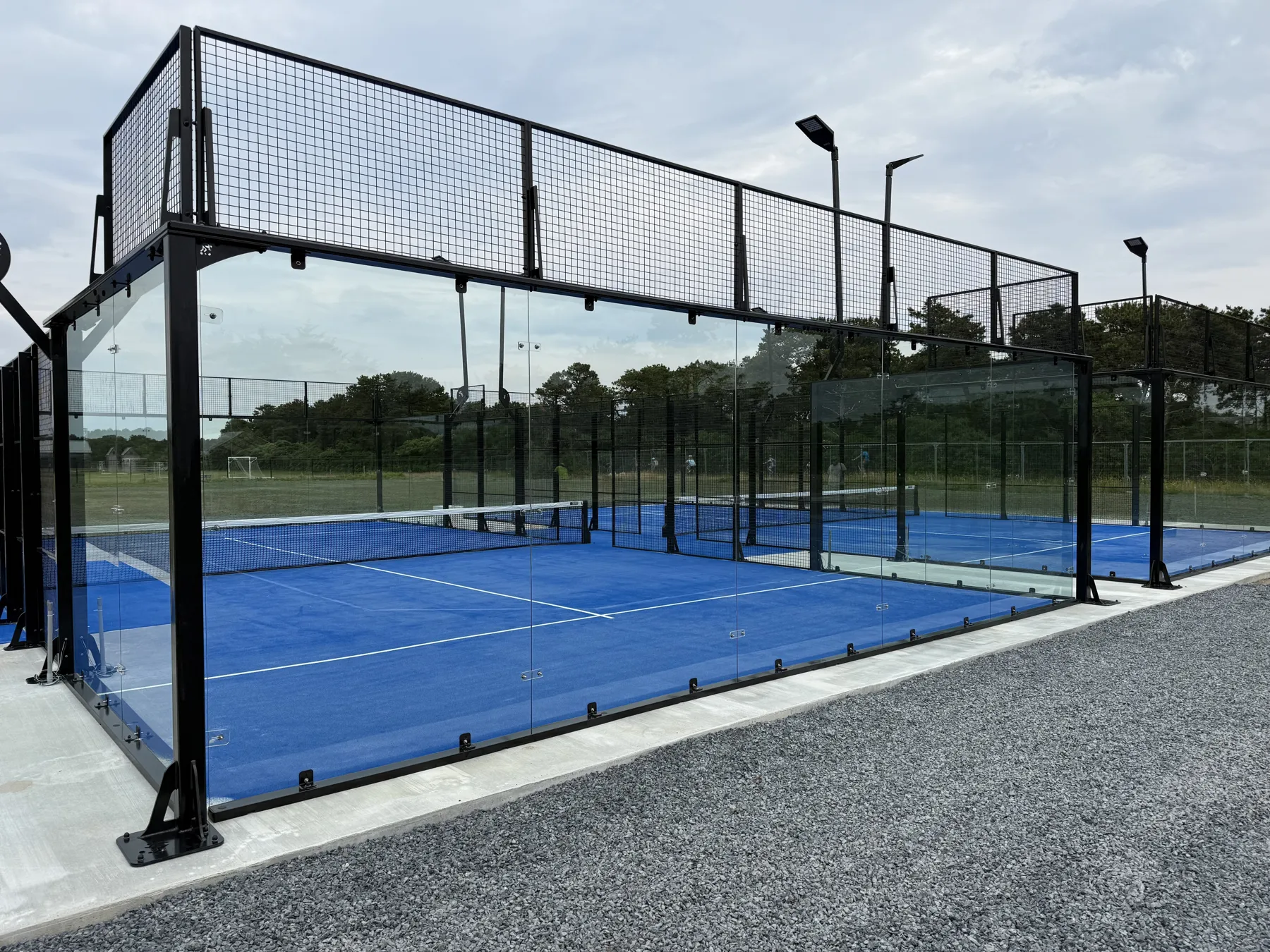 Two glass and mesh padel courts at the Nantucket Racquet Sports Association on Nantucket, Massachusetts